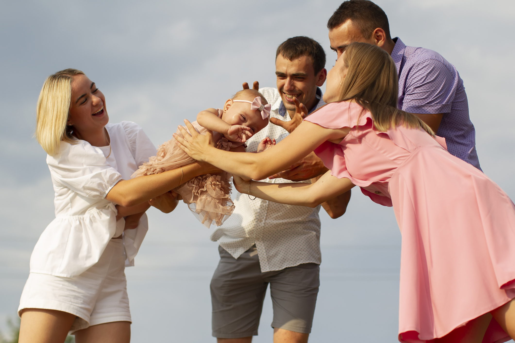 Godparents playing with Godchild