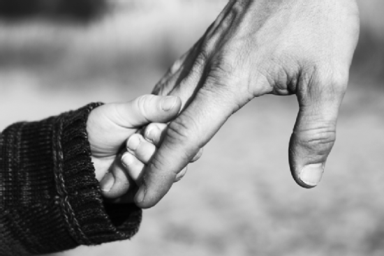 Father and Child Holding Hands