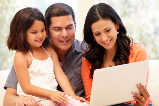 Hispanic family with laptop at home