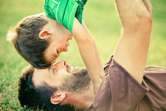 dad play with son outdoor at park