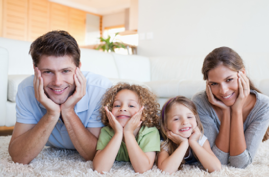 Family lying on a carpet