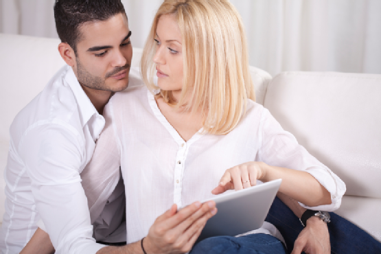 Couple with tablet.