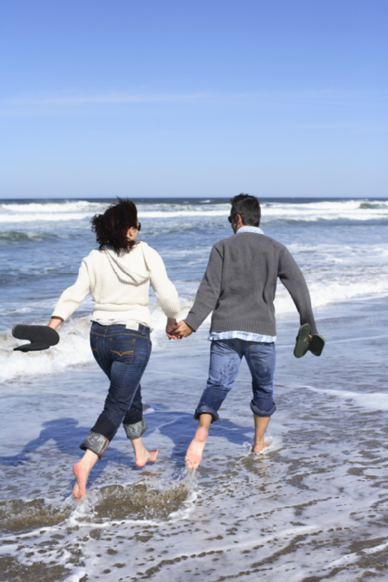 Couple running on beach